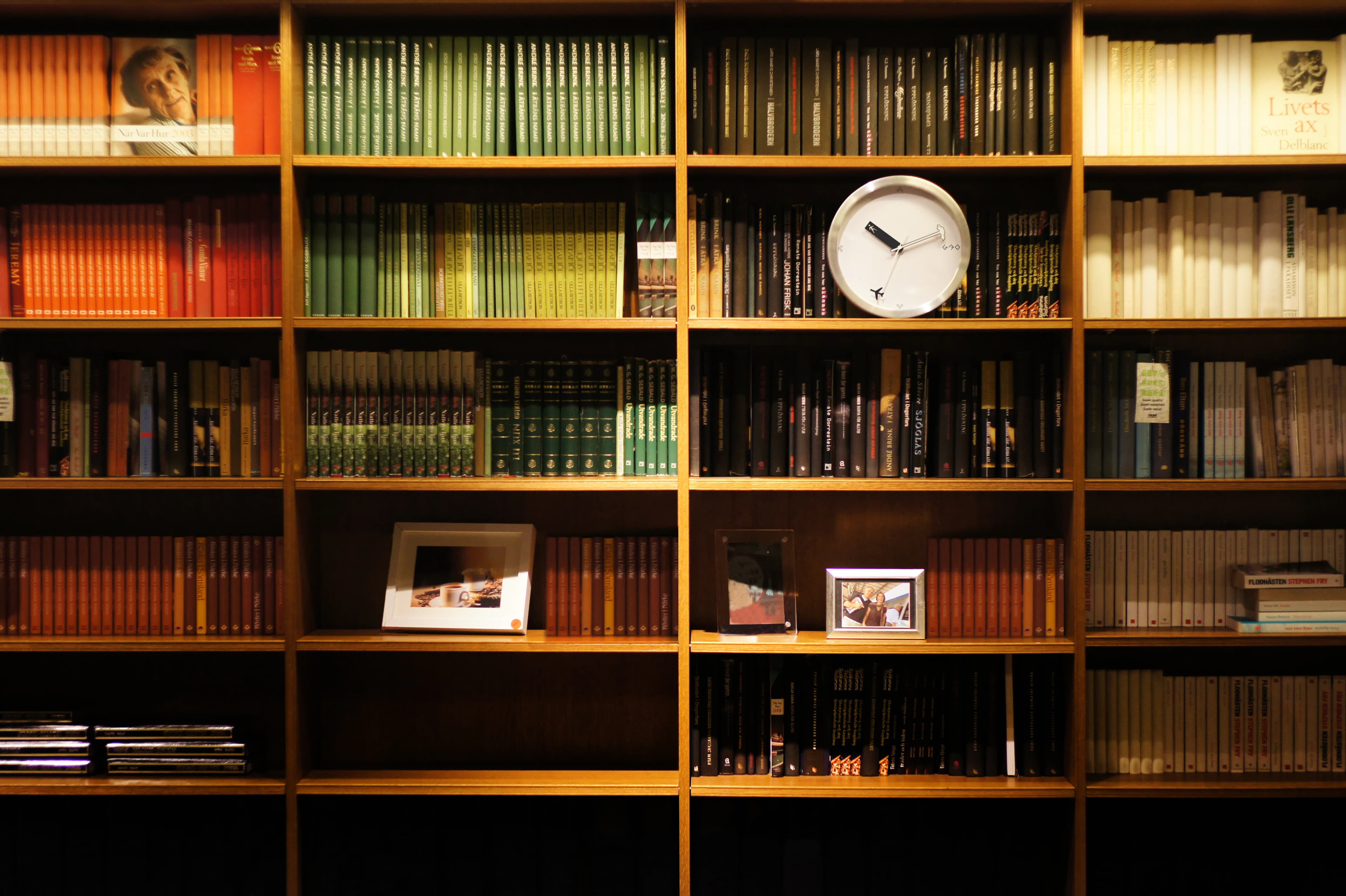 Day By Day clock displayed among bookcases