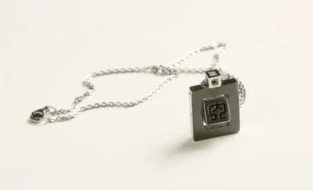 Studio product photograph of the Sanguosha identity-card pendant